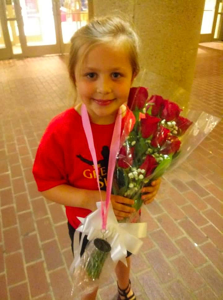 Kimberly is registered to the contest to win money with this photo: bouquet, child, cut_flowers, floral_design, floristry, flower, flower_arranging, joy, person, plant, smile