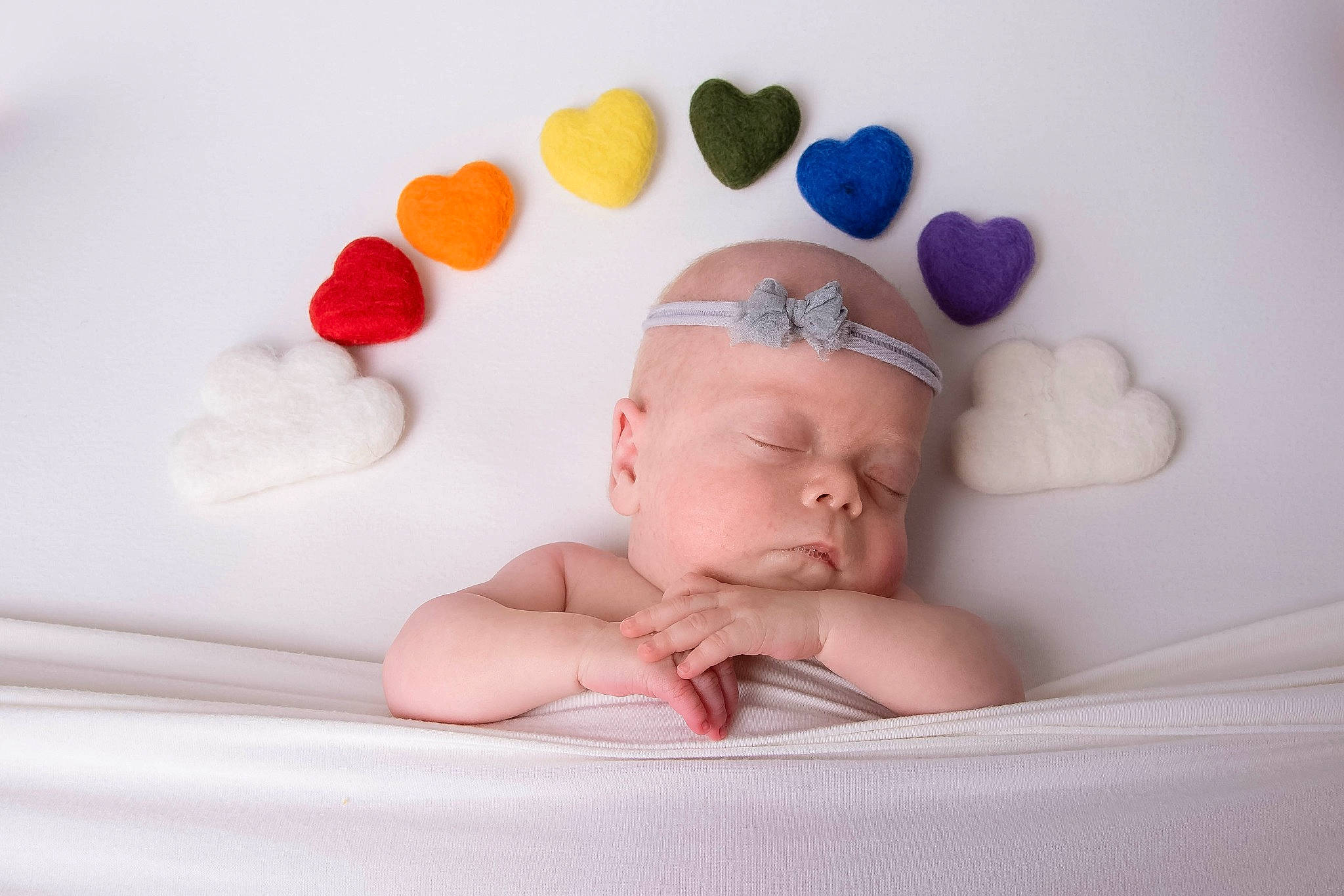 Elaine is registered to the contest to win money with this photo: baby, baby_playing_with_toys, baby_products, baby_sleeping, baby_toddler_clothing, bathing, bed, comfort, fashion_accessory, finger, fun, hand, headgear, infant_bed, linens, person, pink, product, room, textile