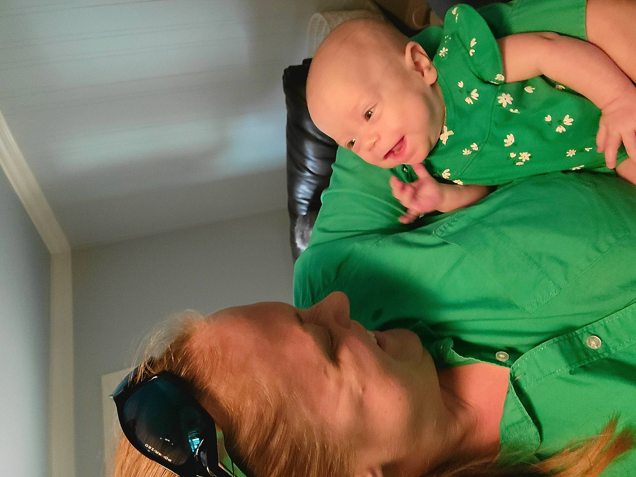 Elaine is registered to the contest to win money with this photo: abdomen, baby, baby_toddler_clothing, beard, child, comfort, elbow, event, fun, green, happy, joint, mouth, muscle, people, person, service, skin, sunglasses, toddler