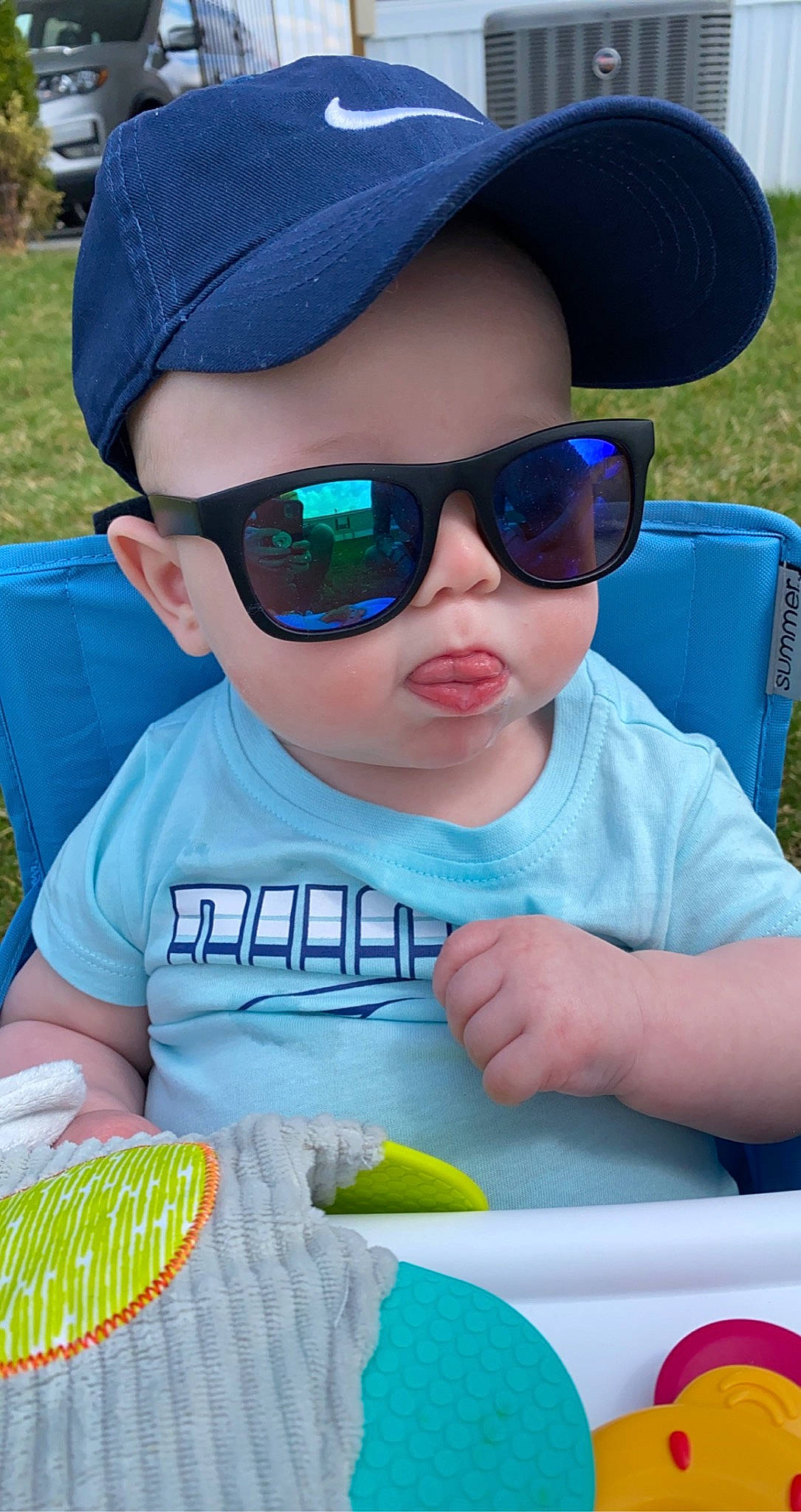 Axton joined the competition — help win amazing prizes! baseball_cap, blue, cap, eyewear, finger, glasses, goggles, green, hat, headwear, light, mouth, person, pink, plant, product, sunglasses, toddler, vertebrate, vision_care