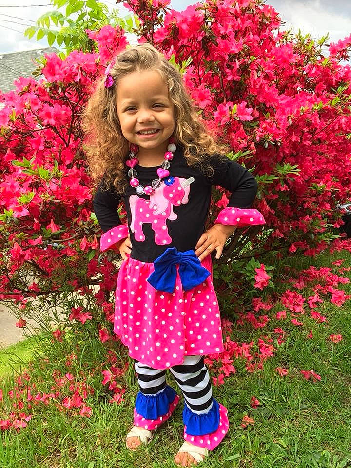 Lillyaunna is registered to the contest to win money with this photo: annual_plant, child, child_model, clothing, costume, dress, fashion_accessory, flower, joy, magenta, pattern, person, petal, pink, plant, shrub, smile, spring, textile, toddler