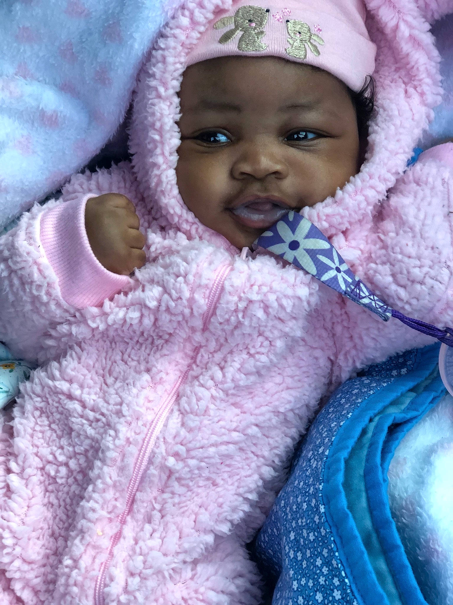 Kailee is registered to the contest to win money with this photo: baby, cheek, child, eye, face, head, headwear, knitting, nose, person, pink, skin, smile, textile, toddler, wool