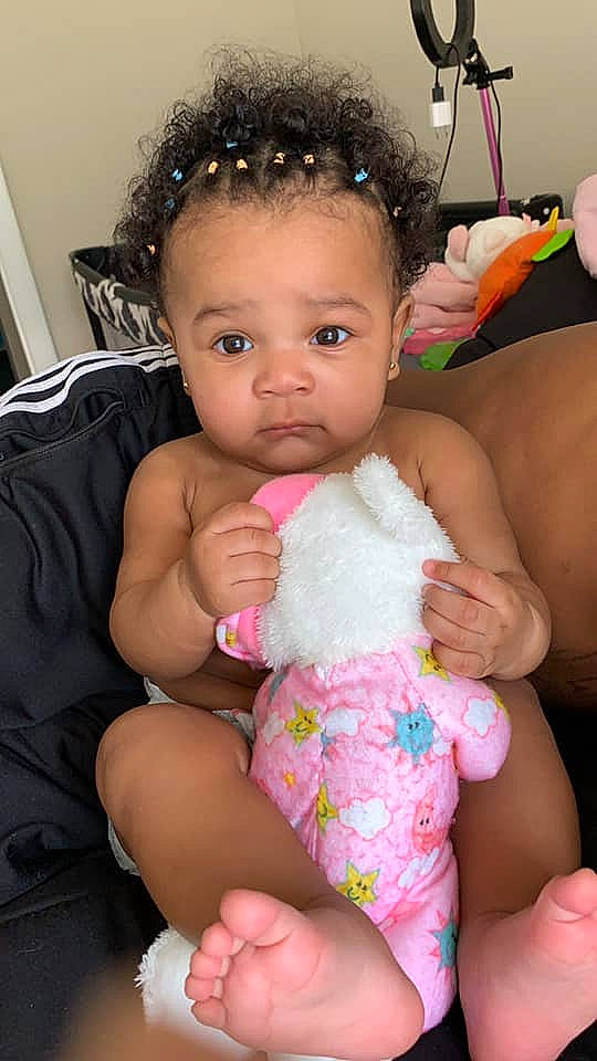 India is registered to the contest to win money with this photo: abdomen, arm, baby, baby_products, black_hair, cheek, chest, child, diaper, finger, hair_accessory, person, pink, skin, thumb, toddler, trunk