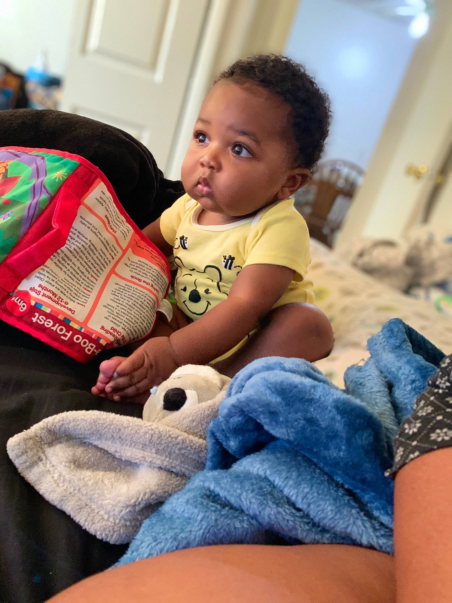 Noah is registered to the contest to win money with this photo: arm, barefoot, blue, child, comfort, denim, finger, flooring, happy, human_leg, joint, knee, lap, leg, mammal, person, shoulder, skin, surprise, thigh