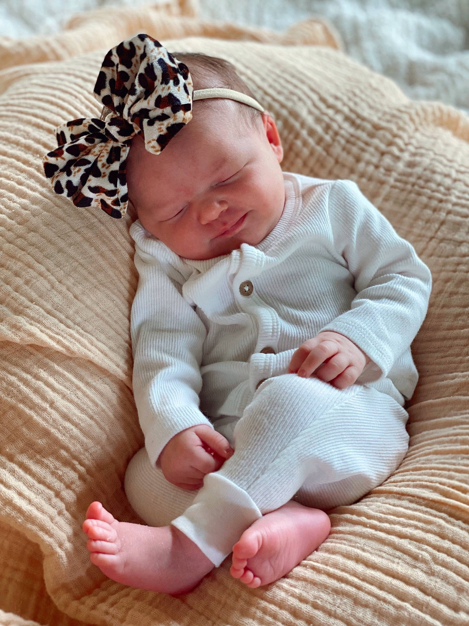 Kohen Renae Youngquist is registered to the contest to win money with this photo: arm, baby, baby_sleeping, baby_toddler_clothing, cheek, comfort, eye, face, finger, foot, gesture, hand, head, headwear, human_body, linens, person, skin, sleeve, toddler