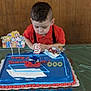 Owen Edward joined the competition — help win amazing prizes! birthday, boy, cake, candle, candles, celebration, child, colorful, face, food, green_tablecloth, happy, icing, number_5, party, person, red_shirt, sonic_the_hedgehog, table, wooden_wall