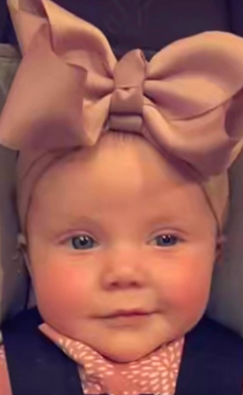 Demi is registered to the contest to win money with this photo: baby, beauty, cheek, ear, eyebrow, eyelash, face, forehead, hair, happy, head, headwear, iris, lip, mouth, nose, organ, person, pink, skin