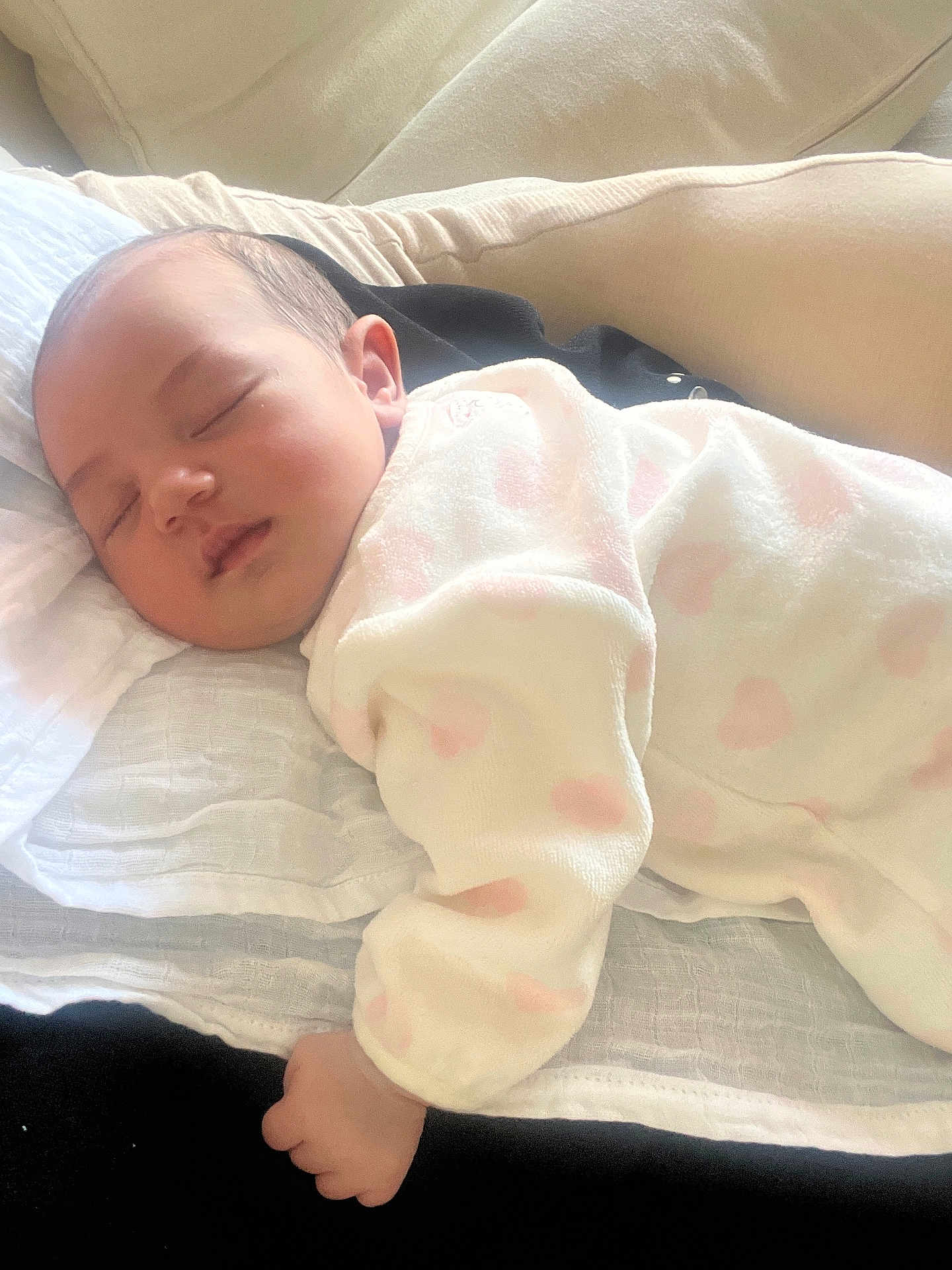 Aria participe au concours pour gagner de l'argent avec cette photo : baby, sleeping, onesie, pink_hearts, blanket, resting, soft, cozy, indoor, infant, peaceful, child, cute, face, hand, portrait, comfort, young, toddler, relaxation