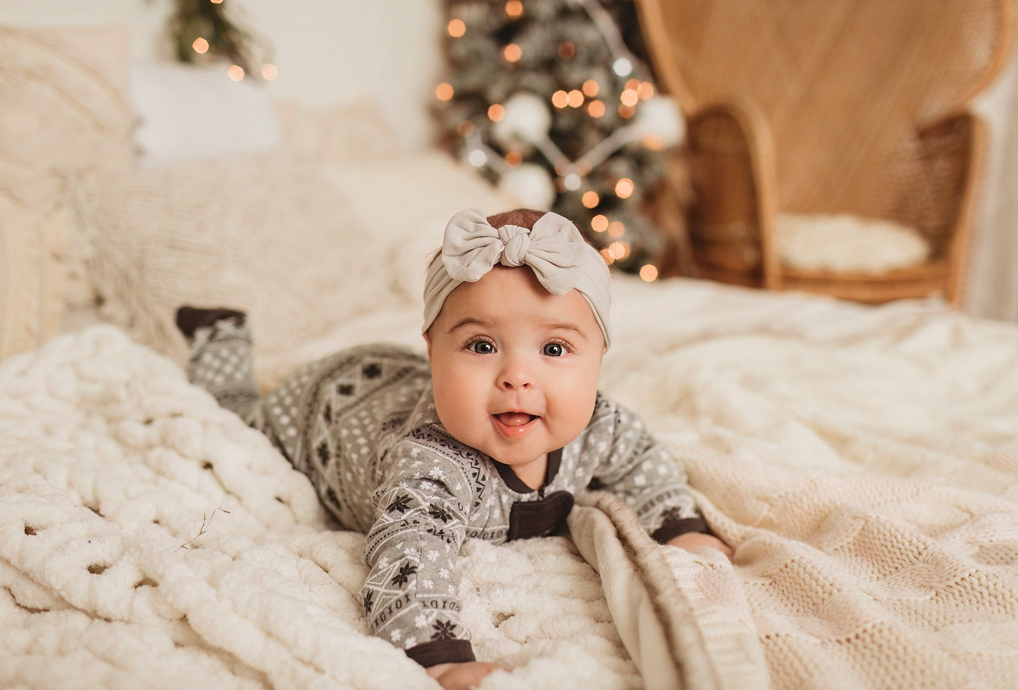Lilia is registered to the contest to win money with this photo: baby, baby_toddler_clothing, child, christmas_decoration, comfort, event, eye, facial_expression, flash_photography, flooring, fun, fur, happy, headwear, linens, person, room, sitting, smile, textile