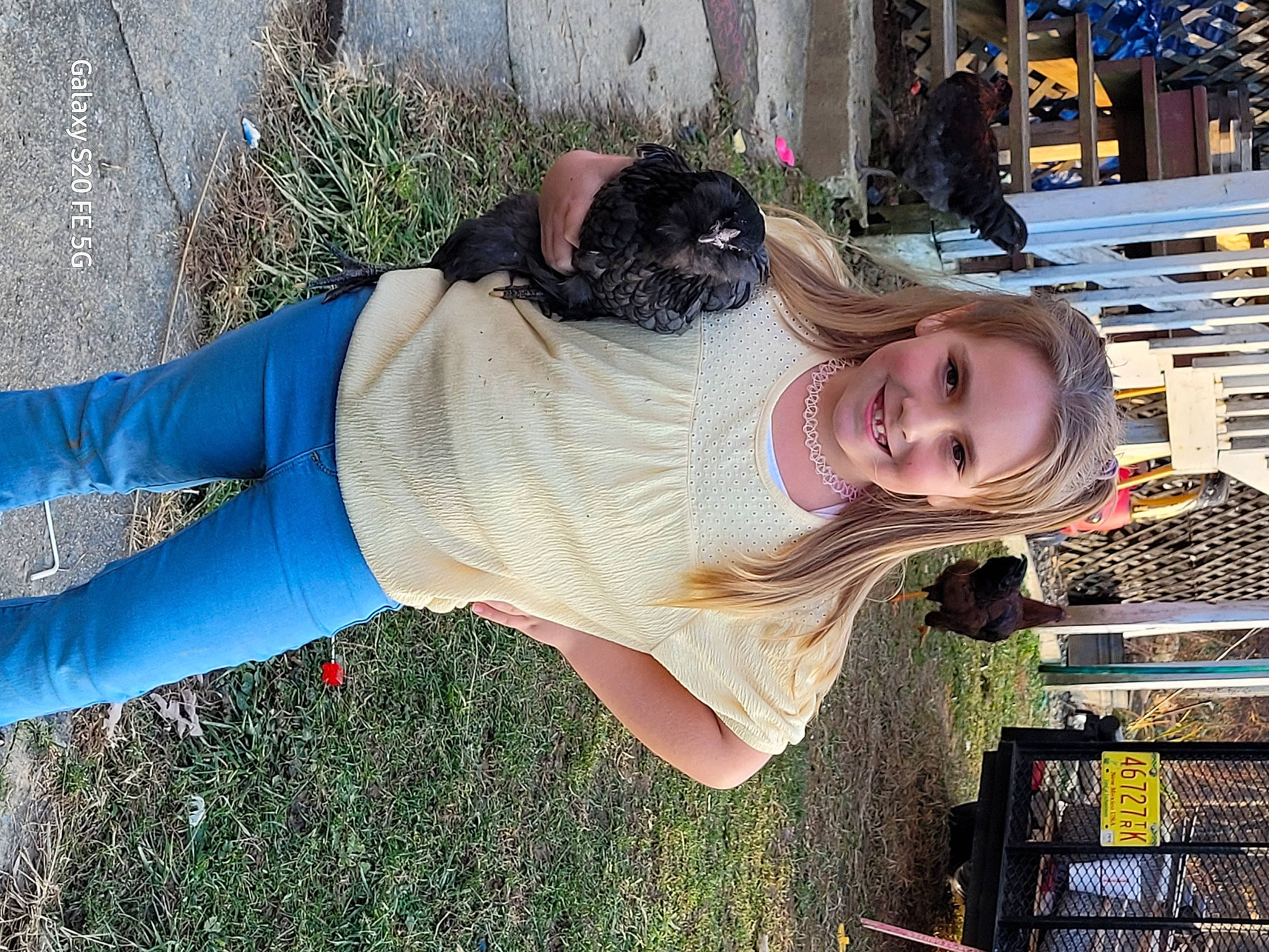 Mallorie is registered to the contest to win money with this photo: abdomen, chest, denim, electric_blue, eyewear, fun, grass, happy, human_leg, joy, knee, leisure, person, plant, sitting, smile, sportswear, thigh, trunk, waist