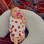 baby, pacifier, blanket, pillow, plaid, red, blue, white, infant, sleepwear, foot, hand, face, person, cute, resting, soft, texture, pattern, cozy