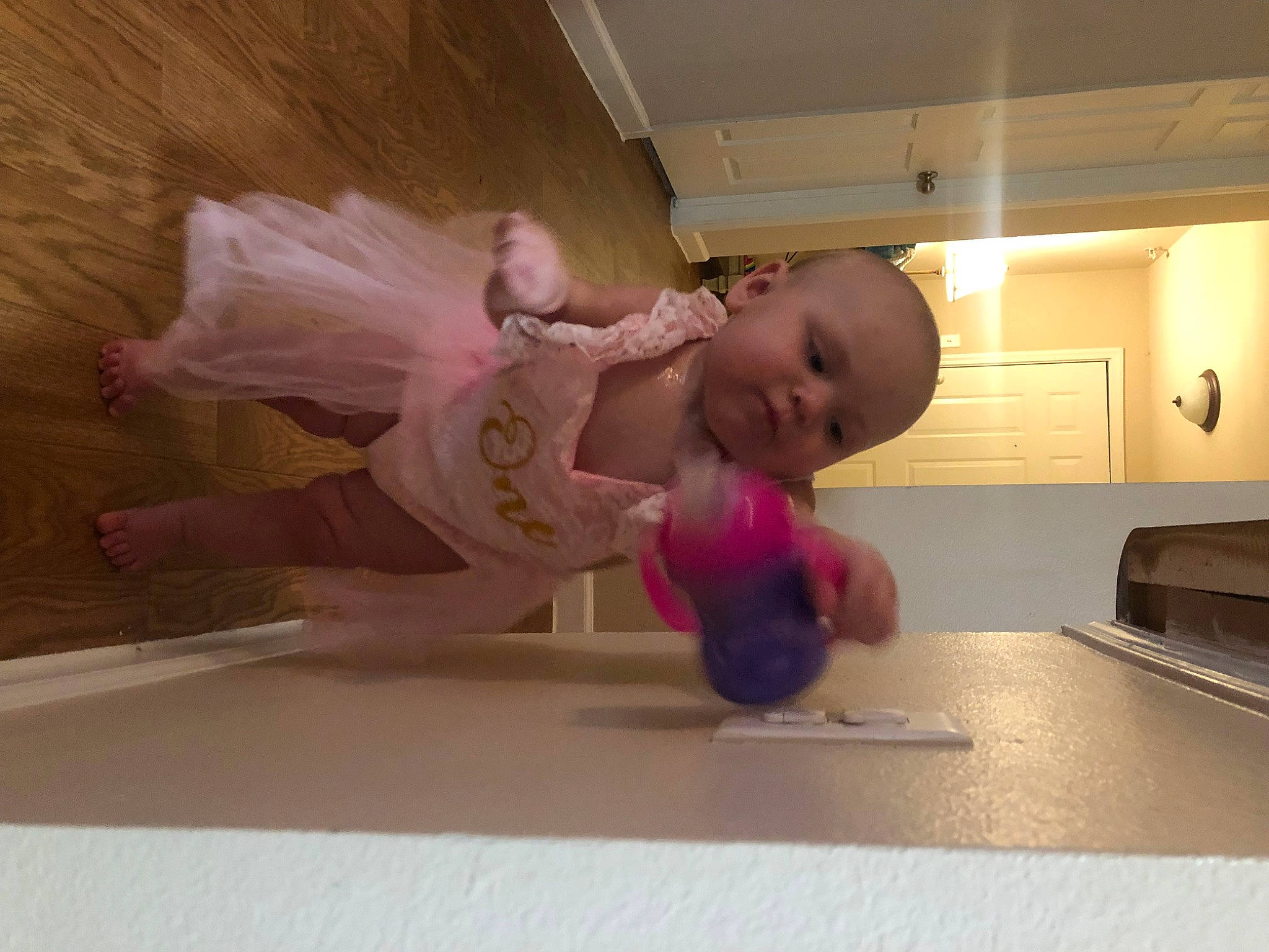 Alyson joined the competition — help win amazing prizes! baby, baby_toddler_clothing, child, comfort, countertop, crawling, floor, flooring, fun, hardwood, kitchen_appliance, knee, magenta, person, room, sitting, toddler, wood