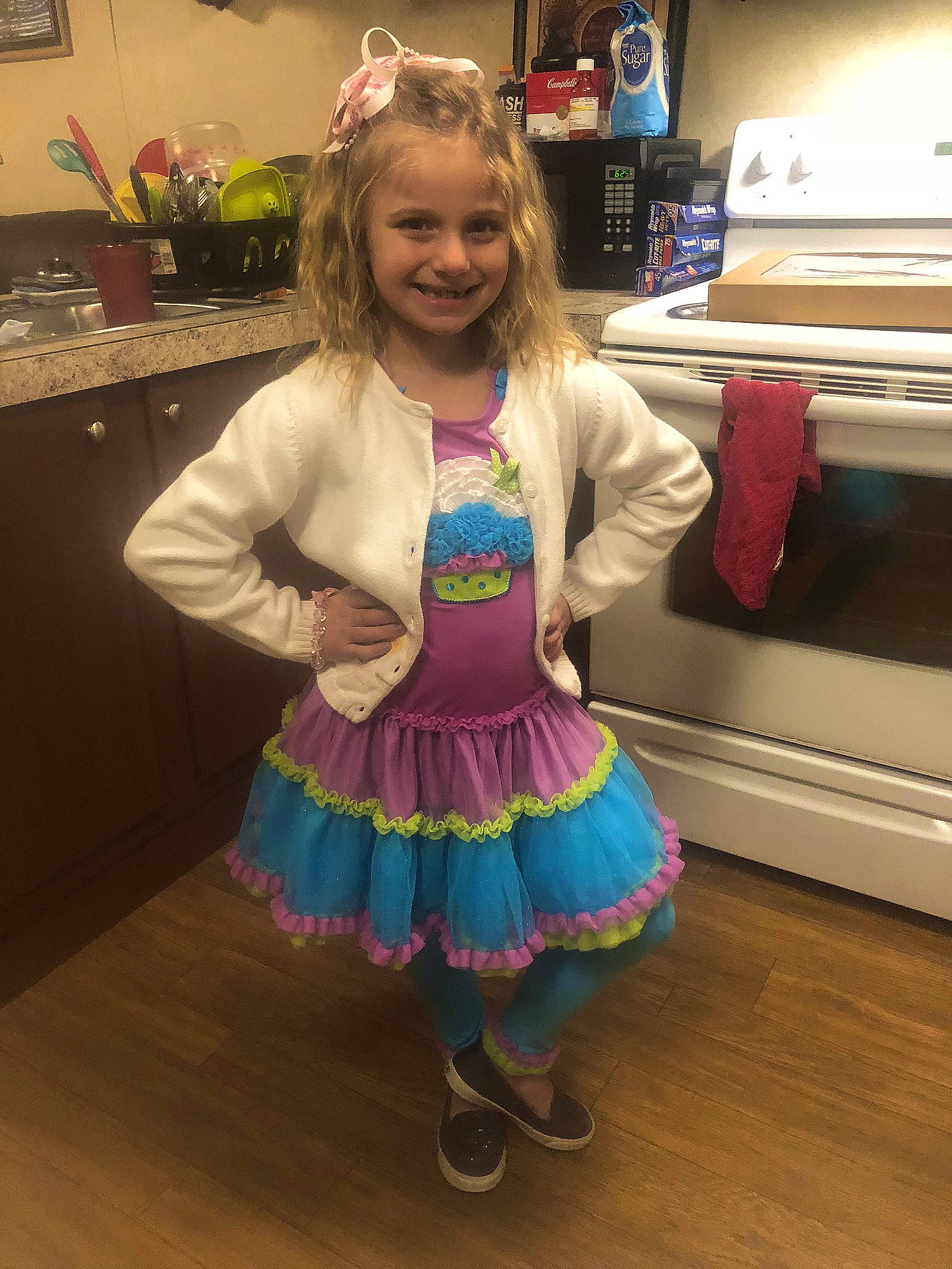 Makennah is registered to the contest to win money with this photo: baby_toddler_clothing, blond, child, costume, dress, event, fashion_accessory, flooring, fun, happy, joy, magenta, pattern, person, pianist, room, sandal, sleeve, smile, sock