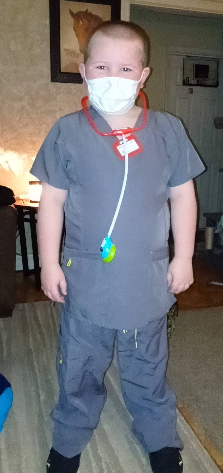 Aaden is registered to the contest to win money with this photo: belt, chest, child, costume, electric_blue, event, eyewear, fashion_accessory, fashion_design, fun, jewellery, person, personal_protective_equipment, room, service, shoulder, sleeve, sports_gear, t_shirt, uniform