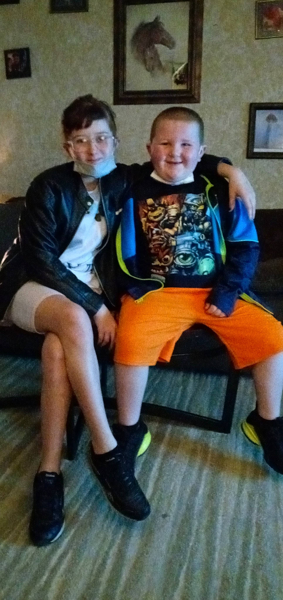 Aaden is registered to the contest to win money with this photo: boot, cool, denim, face, fashion_design, footwear, fun, human_leg, joy, knee, leg, person, picture_frame, shoe, shorts, sitting, smile, sneakers, sock, t_shirt