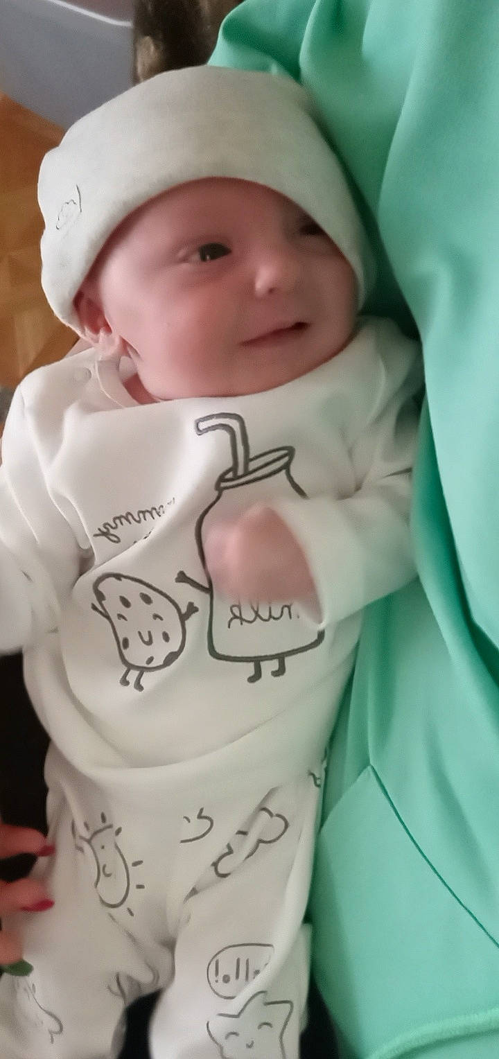 Kolton joined the competition — help win amazing prizes! baby, baby_toddler_clothing, beauty, cap, cheek, child, cool, drinkware, facial_expression, finger, gesture, happy, headwear, lip, person, photograph, pink, skin, sleeve, smile