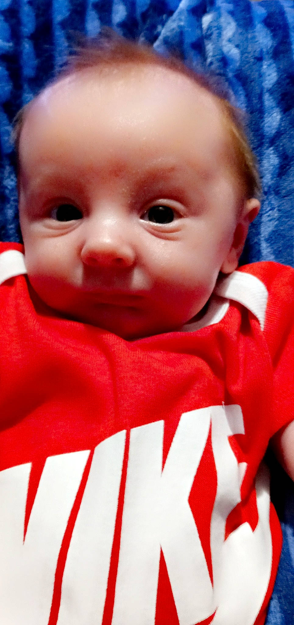 Kolton is registered to the contest to win money with this photo: baby, baby_toddler_clothing, blue, carmine, cheek, child, close_up, comfort, event, eyebrow, eyelash, fun, happy, lip, mouth, nose, person, red, sleeve, t_shirt