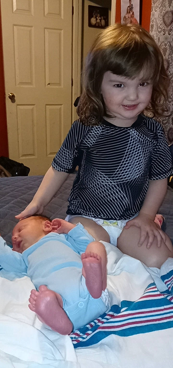 Kynslee Faith is registered to the contest to win money with this photo: arm, baby_toddler_clothing, blue, cheek, comfort, door, eye, face, facial_expression, finger, hand, head, human_body, iris, joint, joy, lap, organ, person, skin