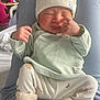 newborn, baby, hat, clothing, socks, infant, cute, sleepy, soft, pastel, cozy, child, person, indoor, cushion, knit, small, peaceful, resting, wrapped
