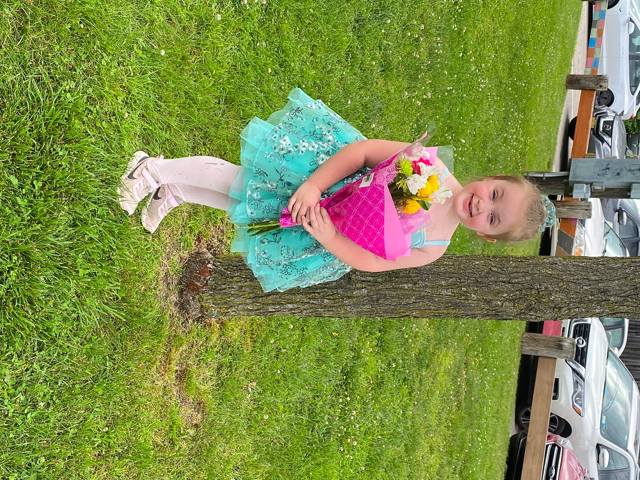 Brielle joined the competition — help win amazing prizes! automotive_exterior, car, child, fun, grass, grass_family, happy, joy, lawn, leisure, mammal, motor_vehicle, people_in_nature, person, plant, recreation, smile, tire, tree, vehicle