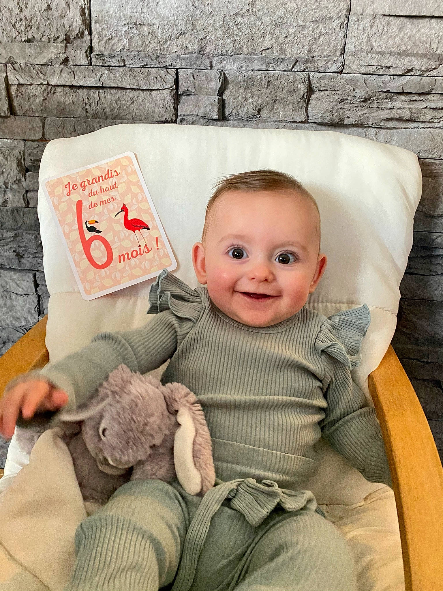 Naomi participe au concours pour gagner de l'argent avec cette photo : art, baby, baby_products, baby_sleeping, baby_toddler_clothing, brick, chair, cheek, child, comfort, eye, flash_photography, happy, joy, linens, person, room, sitting, skin, smile