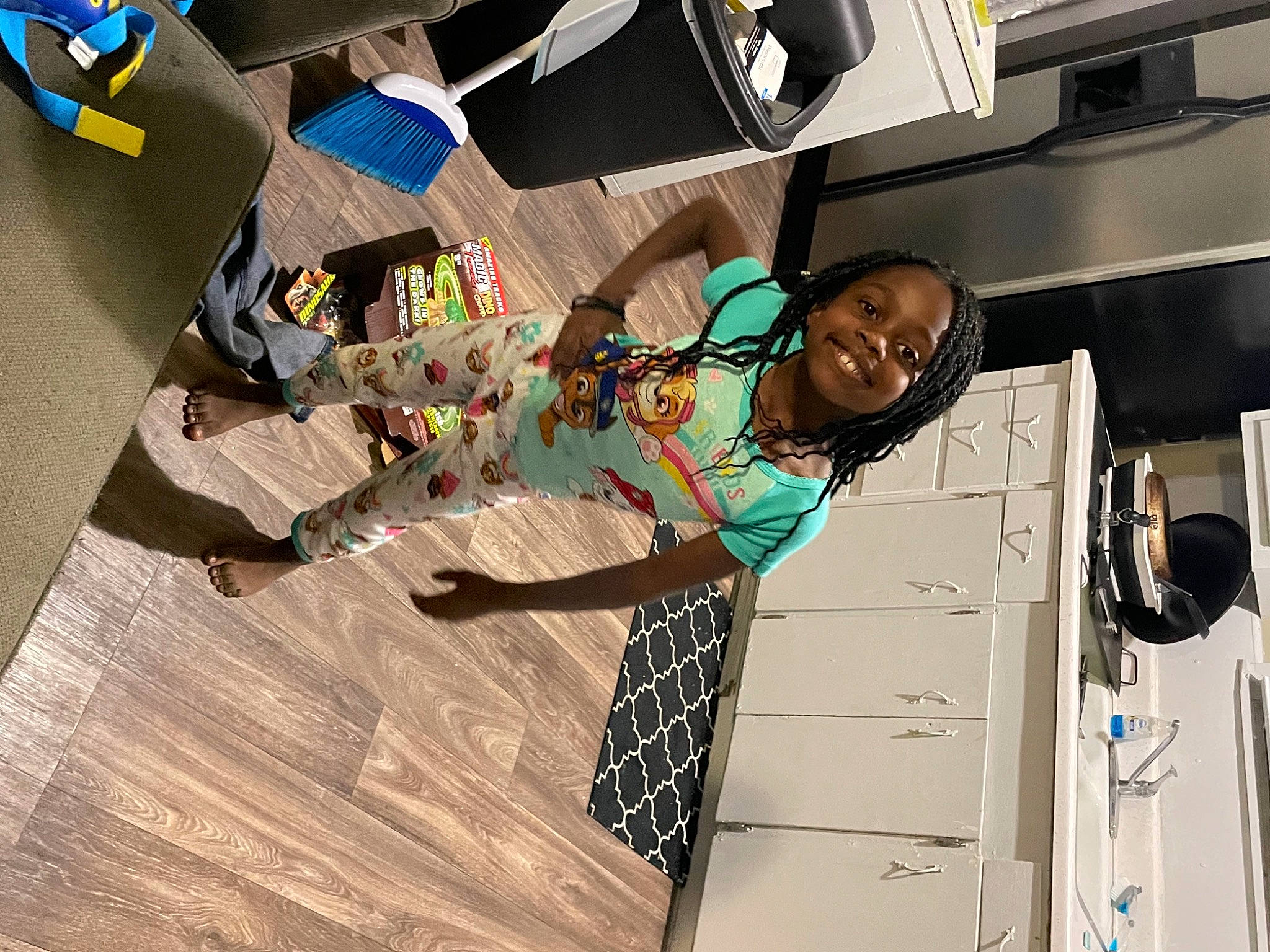 Holly is registered to the contest to win money with this photo: art, child, event, eyewear, fashion_design, flooring, fun, hardwood, joy, pattern, person, room, smile, street_fashion, t_shirt, toddler, visual_arts, wood, wood_flooring, wood_stain