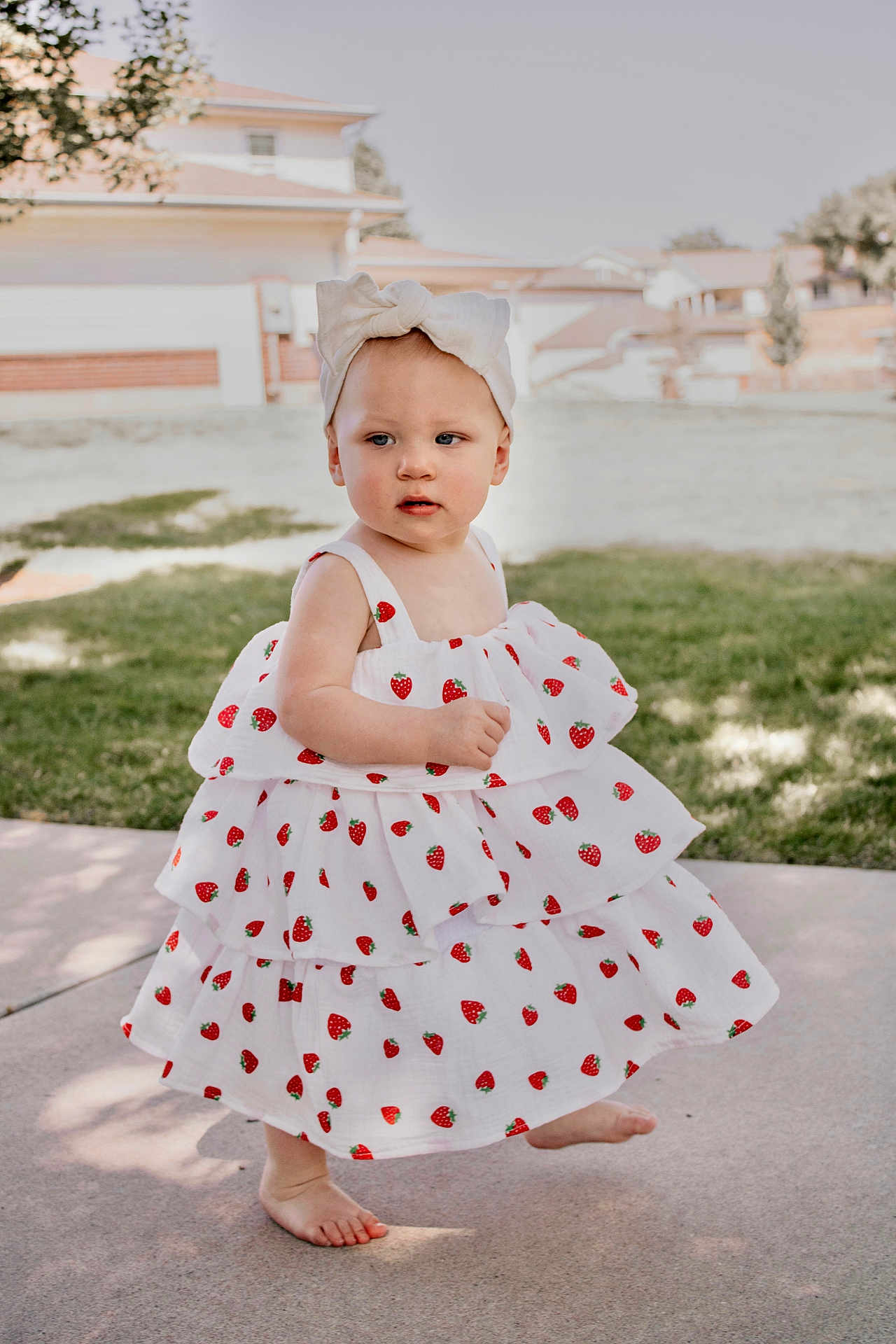 Alizah joined the competition — help win amazing prizes! toddler, child, dress, headband, strawberry_pattern, barefoot, outdoor, sidewalk, grass, sunlight, curious, baby, person, summer, fashion, cute, walking, garden, daytime, portrait