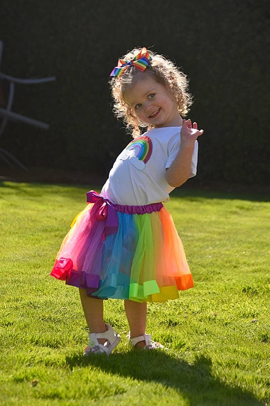 Suzie is registered to the contest to win money with this photo: baby_toddler_clothing, child, dress, entertainment, event, flash_photography, fun, grass, grassland, happy, joy, lawn, magenta, meadow, people_in_nature, person, pink, plant, recreation, shoe