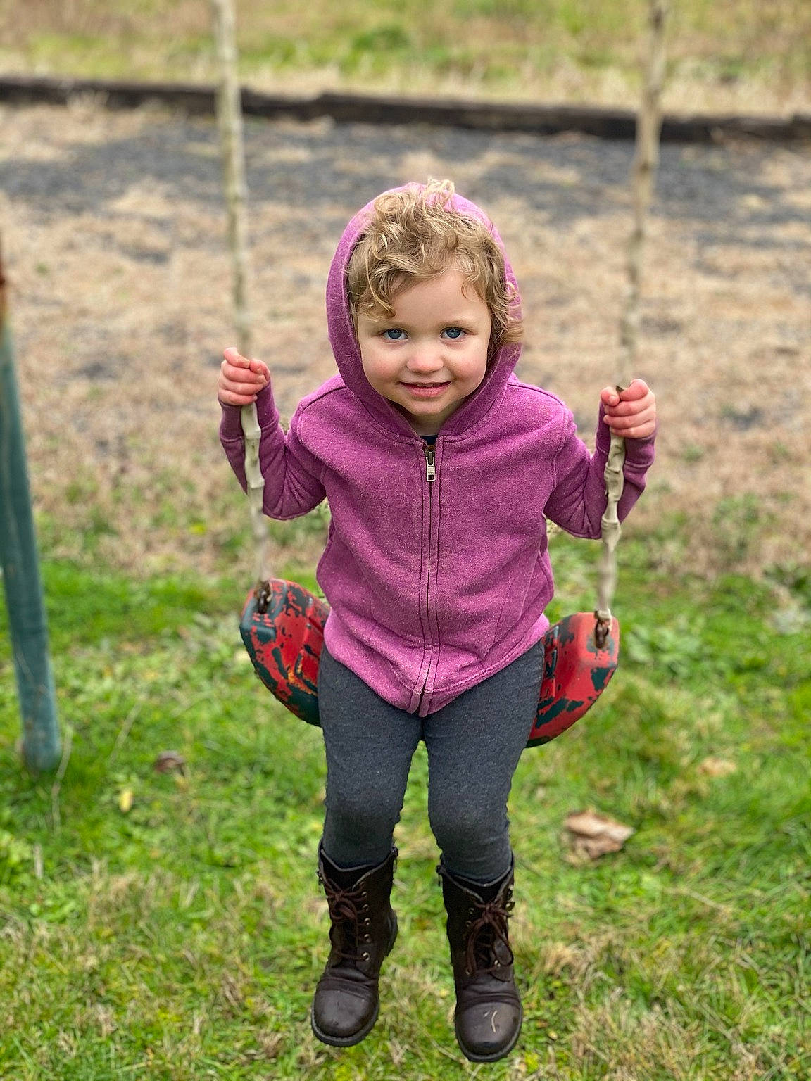 Suzie joined the competition — help win amazing prizes! baby, baby_toddler_clothing, child, eye, fun, grass, happy, jeans, joy, leaf, leg, leisure, outdoor_play_equipment, people_in_nature, person, plant, recreation, smile, sneakers, swing