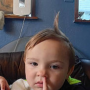 Vengeance joined the competition — help win amazing prizes! toddler, child, indoor, face, finger, nose, hair, expression, blanket, couch, blue_wall, window, curtain, person, portrait, casual, cute, young_child, sitting, curious