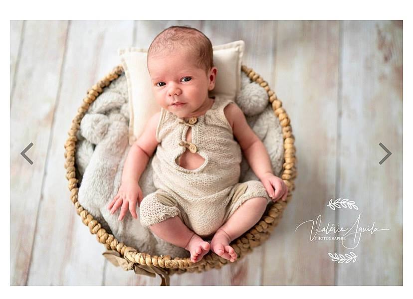 Owen participe au concours pour gagner de l'argent avec cette photo : baby, baby_toddler_clothing, child, collectable, fashion_accessory, font, foot, fur, happy, jewellery, pattern, peach, person, portrait_photography, sitting, sleeve, smile, stock_photography, toddler, wood