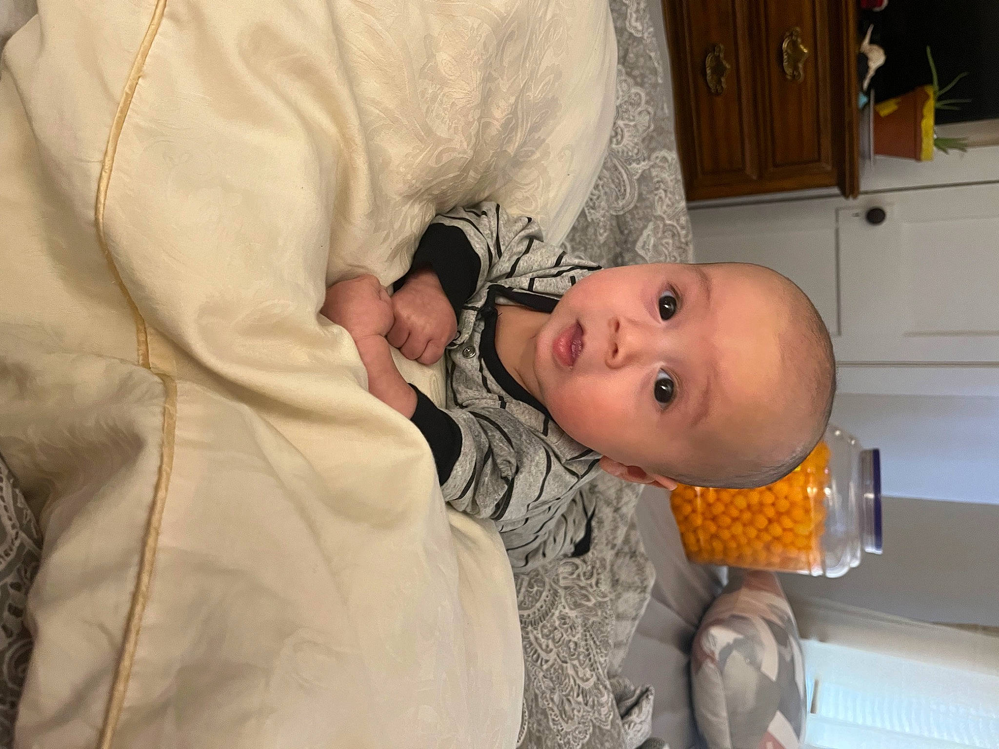 Mateó is registered to the contest to win money with this photo: baby, baby_products, baby_safety, baby_toddler_clothing, cabinetry, chest_of_drawers, child, comfort, cupboard, drawer, kitchen, kitchen_appliance, mouth, nose, person, refrigerator, room, shelf, skin, sleeve