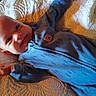 Atlas joined the competition — help win amazing prizes! baby, child, smile, blue_outfit, quilt, textile, bed, infant, lying_down, happy, face, portrait, cozy, warm_lighting, indoor, cute, young_child, sleepwear, soft_texture, comfort