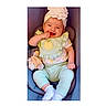 baby, child, smiling, happy, portrait, car_seat, headband, flower, plush_toy, infant, sitting, indoors, clothing, pastel_colors, green_outfit, white_socks, finger_in_mouth, joyful, close_up, photography