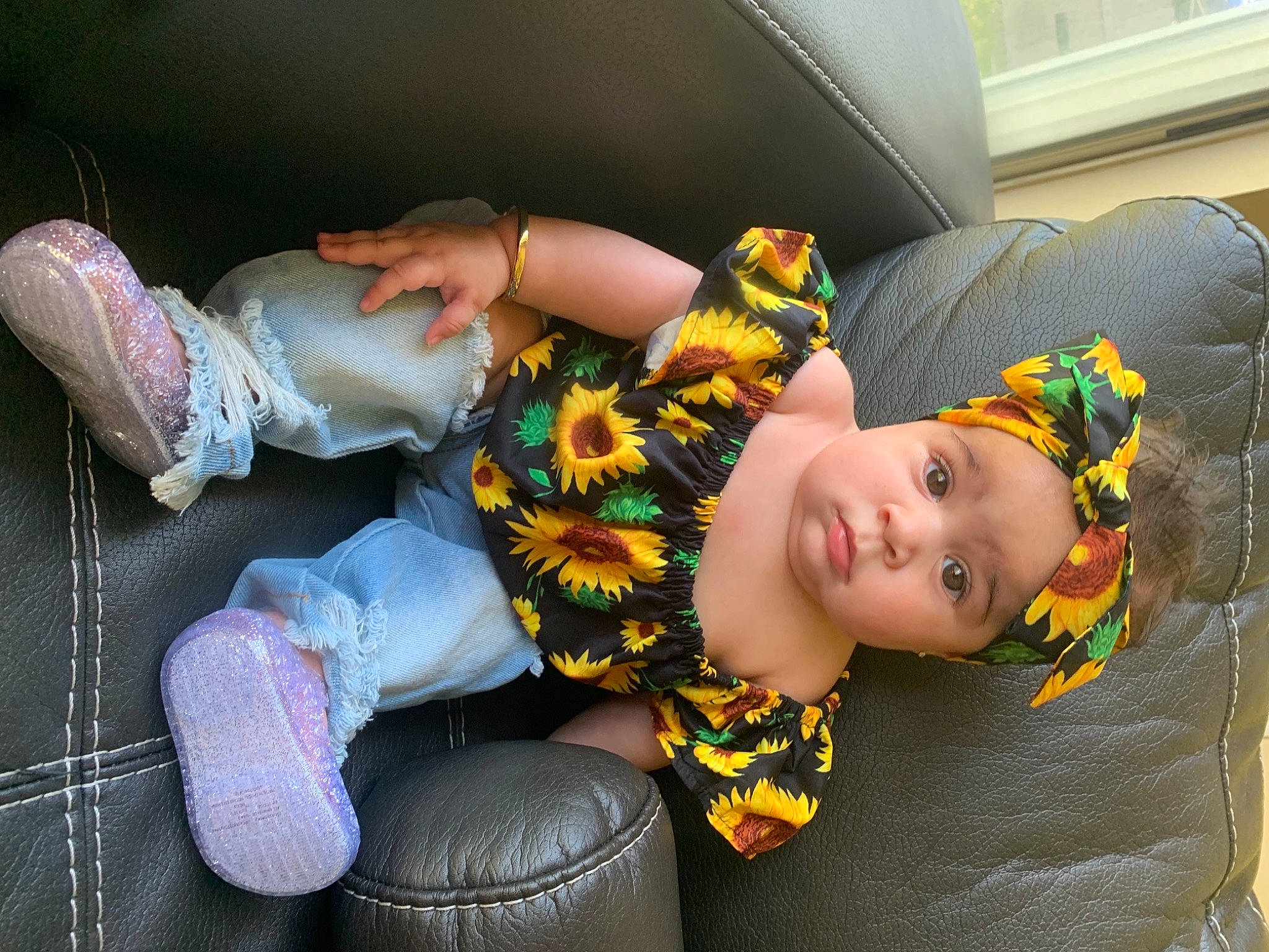 Genniah joined the competition — help win amazing prizes! auto_part, automotive_tire, beauty, black_hair, car_seat, child, comfort, couch, fashion_accessory, flooring, fun, grass, headwear, human_leg, lap, leg, person, room, sitting, textile