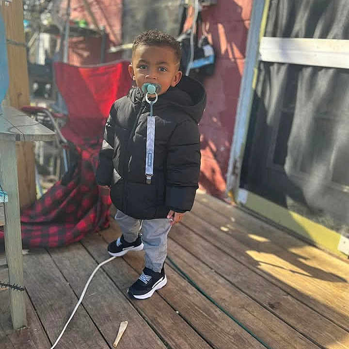 Greyson is registered to the contest to win money with this photo: architecture, boy, building, child, clothing, coat, electricaldevice, face, head, house, housing, indoors, interiordesign, jacket, male, microphone, person, photography, porch, portrait