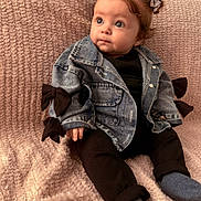Ambre participe au concours pour gagner de l'argent avec cette photo : baby, black_outfit, blanket, blue_eyes, bow, child, chubby_cheeks, cozy, cute, denim_jacket, fashion, gaze, hair_bows, indoor, infant, knitted_blanket, portrait, sitting, socks, soft_texture