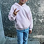 Mathis a rejoint le concours — aidez-le/la à gagner de superbes lots ! child, boy, peace_sign, hoodie, light_pink, jeans, sneakers, standing, concrete, wall, casual, pose, outdoor, smile, short_hair, young, fashion, street_style, portrait, confident