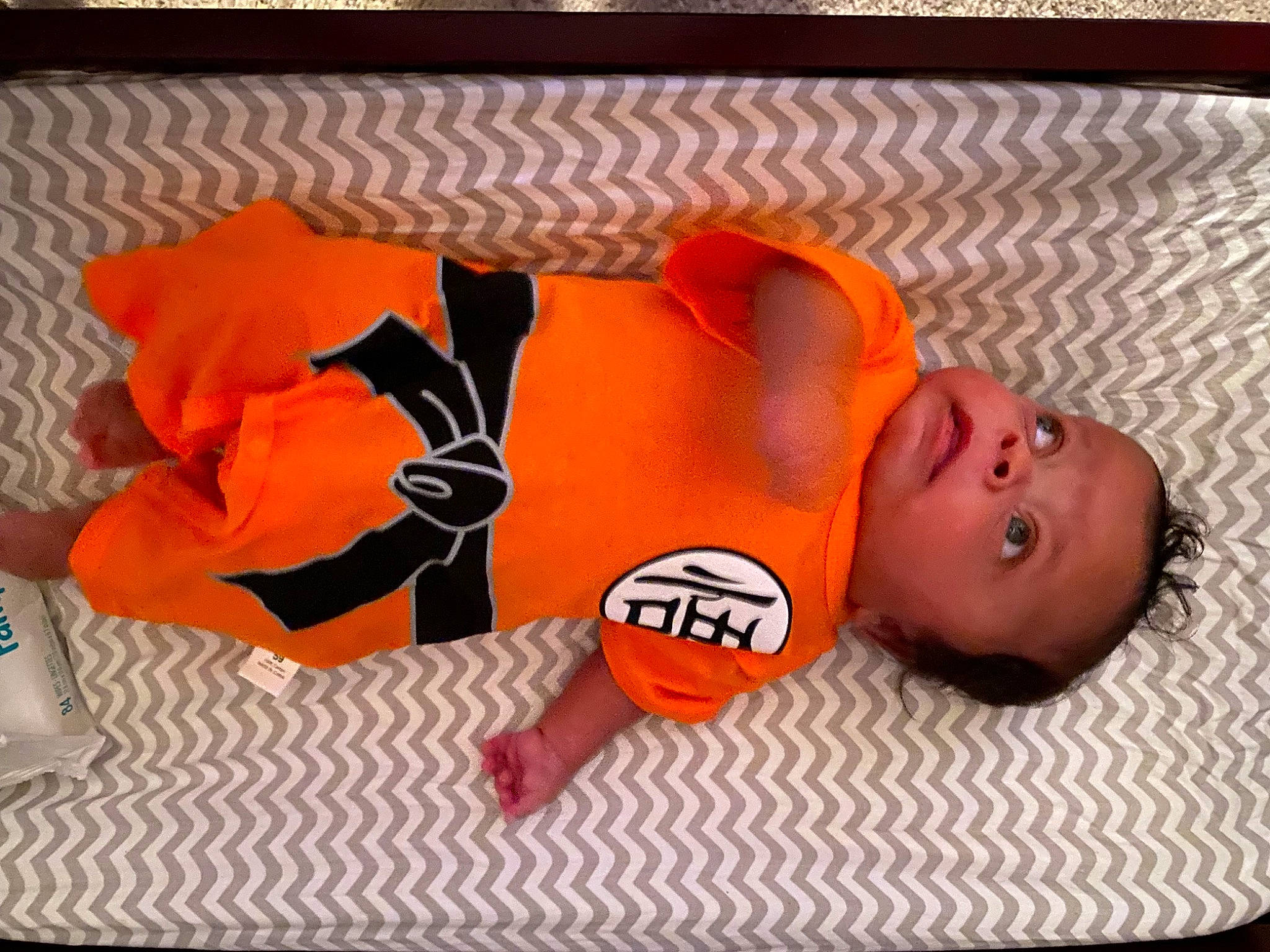 Kaedyn is registered to the contest to win money with this photo: baby, baby_products, baby_sleeping, baby_toddler_clothing, bedtime, child, comfort, font, linens, nap, orange, person, room, sleep, sleeve, textile, toddler