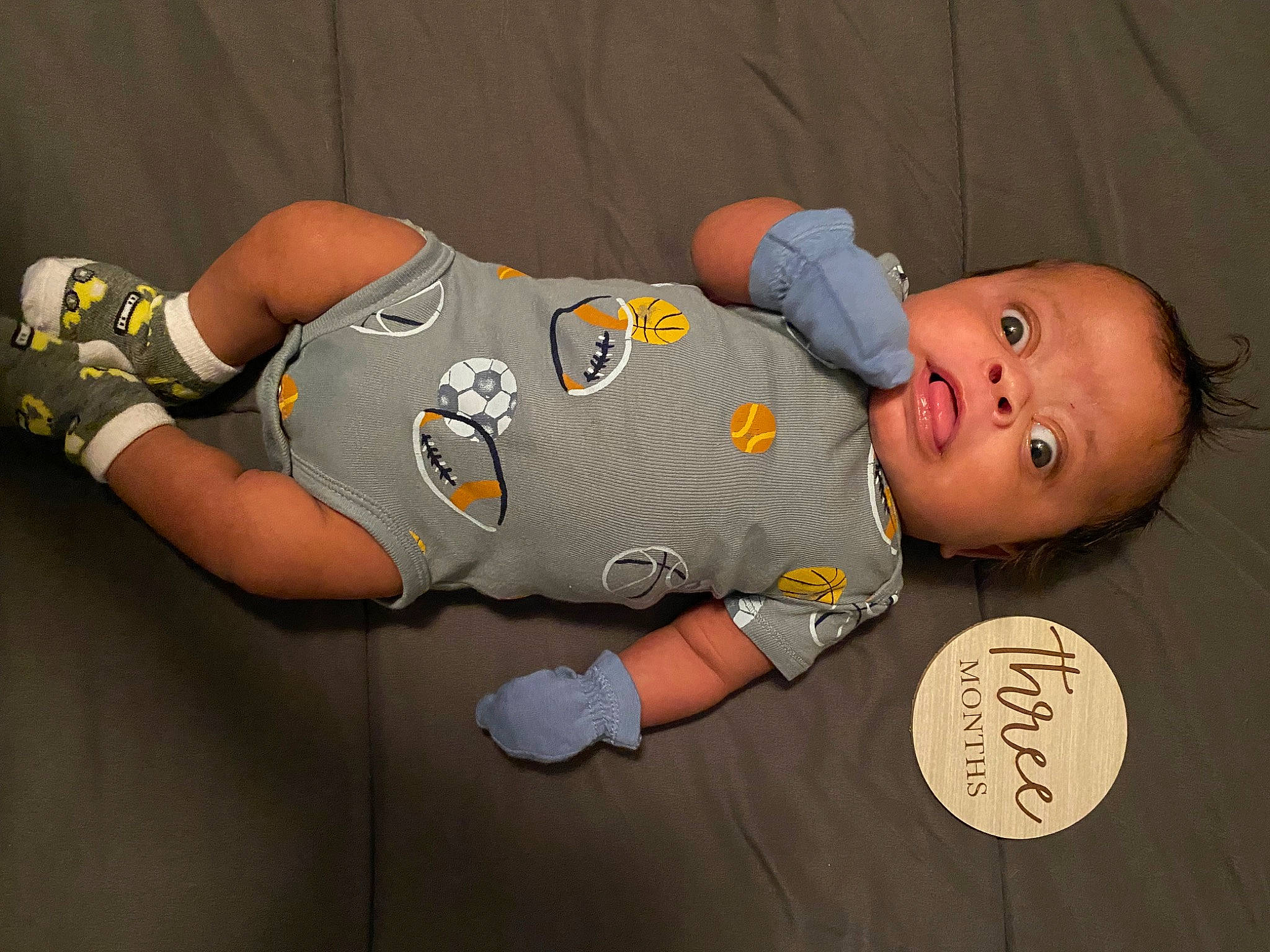 Kaedyn is registered to the contest to win money with this photo: baby, baby_products, baby_toddler_clothing, child, comfort, elbow, font, gesture, human_leg, jersey, knee, pattern, person, personal_protective_equipment, sleeve, sportswear, t_shirt, thigh, toddler, uniform