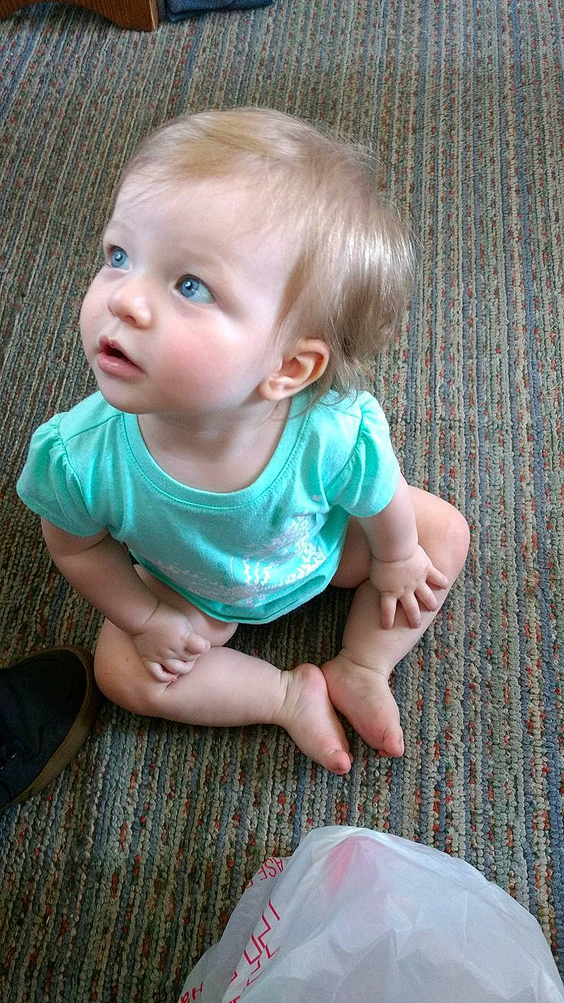 Aria is registered to the contest to win money with this photo: cheek, child, eye, face, fun, girl, happiness, head, human_hair_color, infant, iris, person, product, sitting, skin, smile, toddler