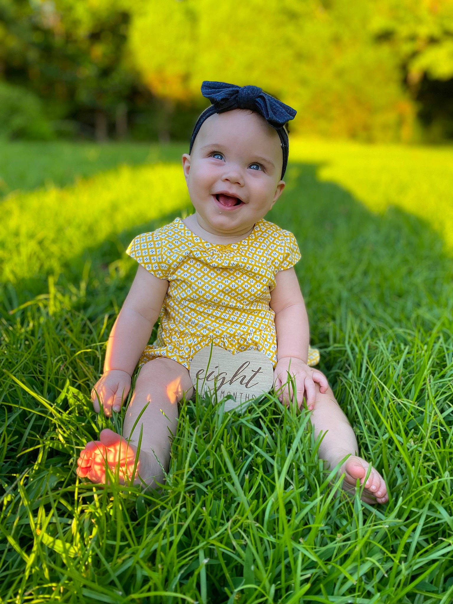 Malia is registered to the contest to win money with this photo: baby, baby_laughing, baby_toddler_clothing, botany, child, face, fun, grass, grass_family, grassland, happy, headwear, joy, leaf, meadow, people_in_nature, person, plant, smile, sunlight