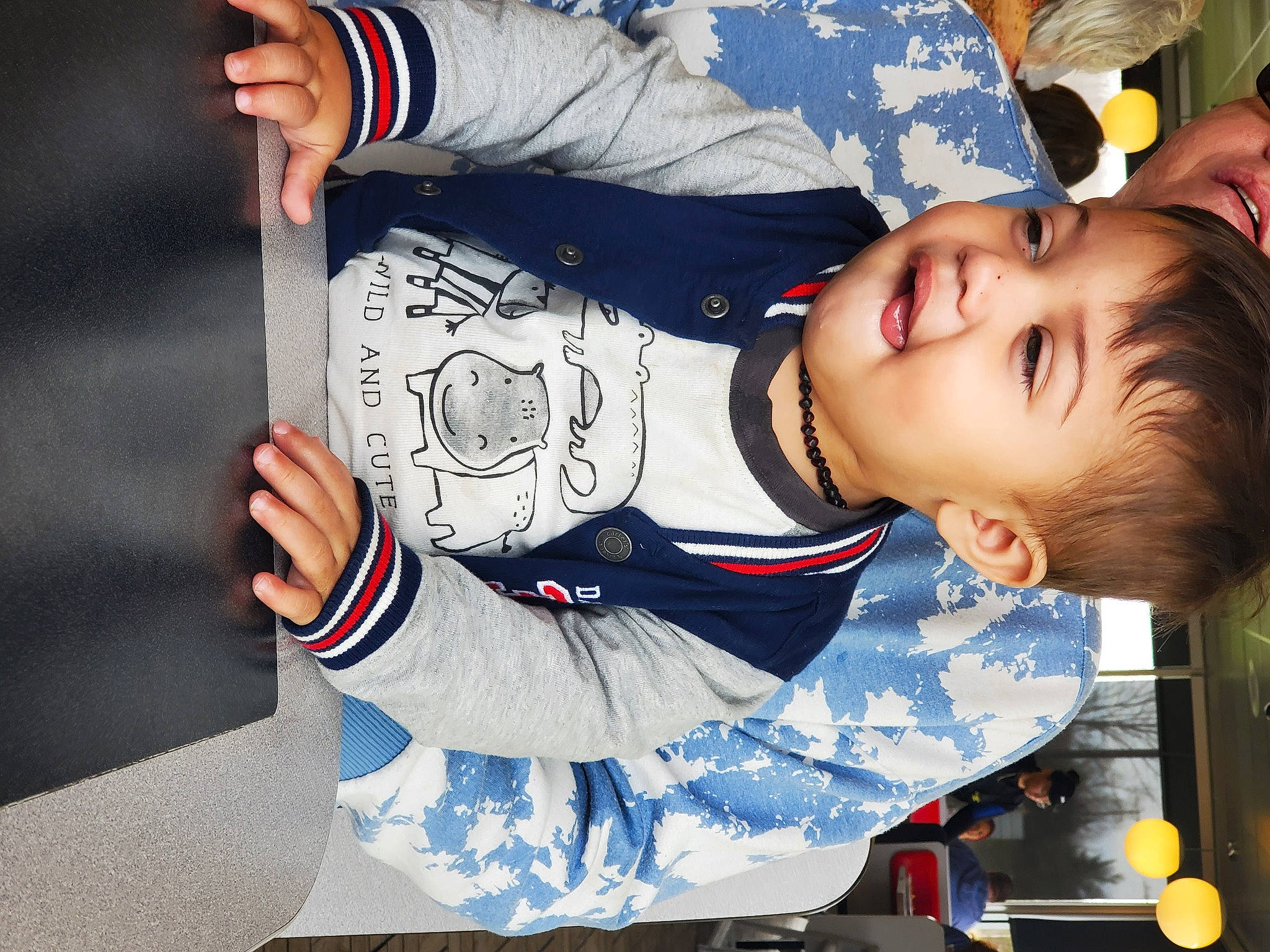 Braxton joined the competition — help win amazing prizes! baby, baby_toddler_clothing, black_hair, carmine, child, elbow, electric_blue, finger, fun, gesture, happy, pattern, person, sitting, sleeve, smile, snapshot, toddler, wrist