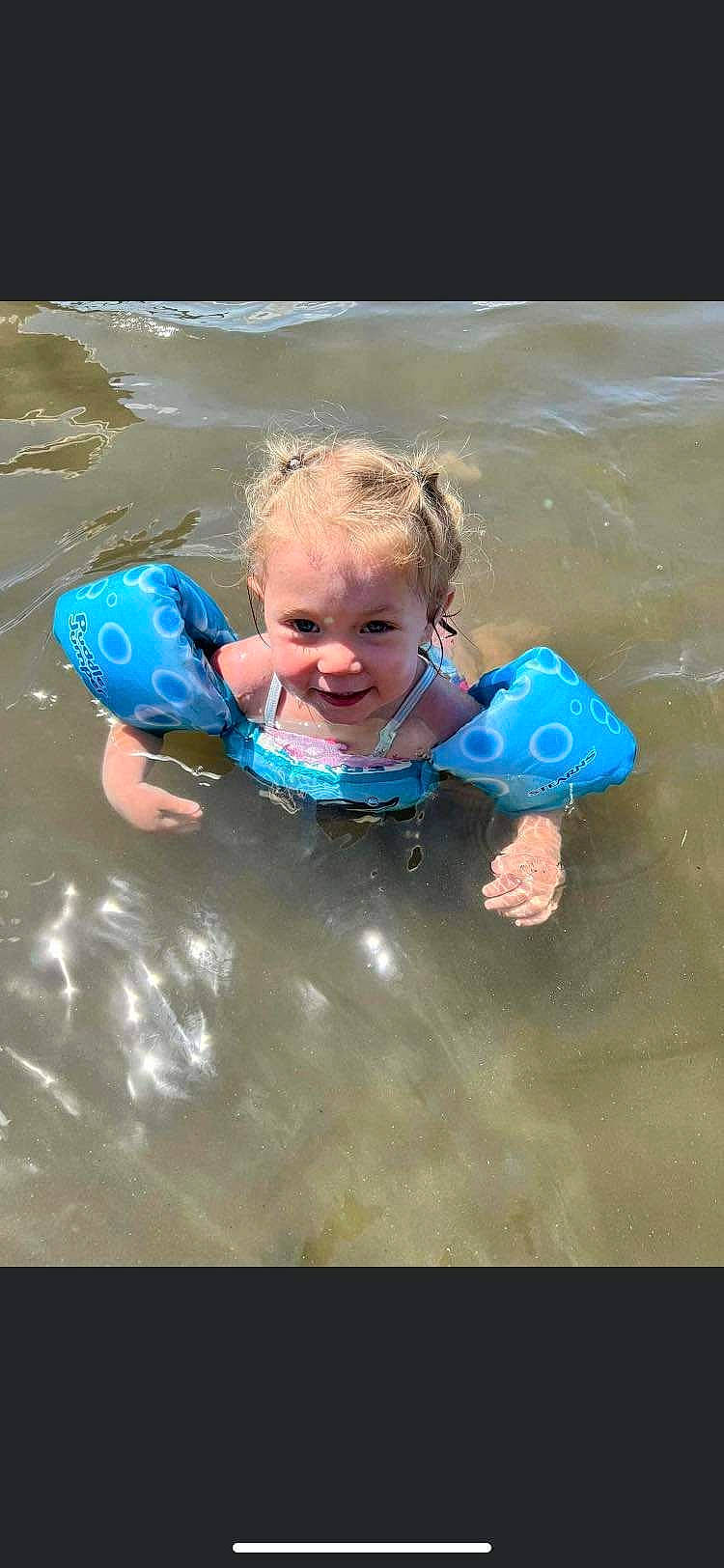 Avianna joined the competition — help win amazing prizes! aqua, baby, bathing, child, electric_blue, fun, happy, leisure, lifejacket, ocean, people_on_beach, person, personal_protective_equipment, play, recreation, smile, swimwear, toddler, vacation, water