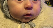 Beau is registered to the contest to win money with this photo: baby, beanie, bodypart, bonnet, cap, clothing, face, finger, fleece, hand, hat, head, hood, hoodie, knitwear, person, photography, portrait, sweater, sweatshirt