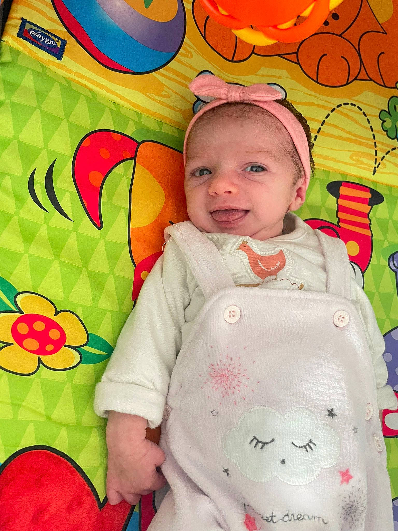 Lana a rejoint le concours — aidez-le/la à gagner de superbes lots ! baby, baby_toddler_clothing, cheek, face, happy, head, jacket, orange, outerwear, pattern, person, pink, product, red, skin, sleeve, smile, t_shirt, textile, toddler