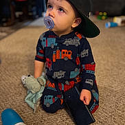 Giovanni is registered to the contest to win money with this photo: baby, baseballcap, beanie, beverage, bodypart, bonnet, brush, cap, clothing, coffee, coffeecup, couch, cup, device, dress, face, finger, fleece, footwear, furniture