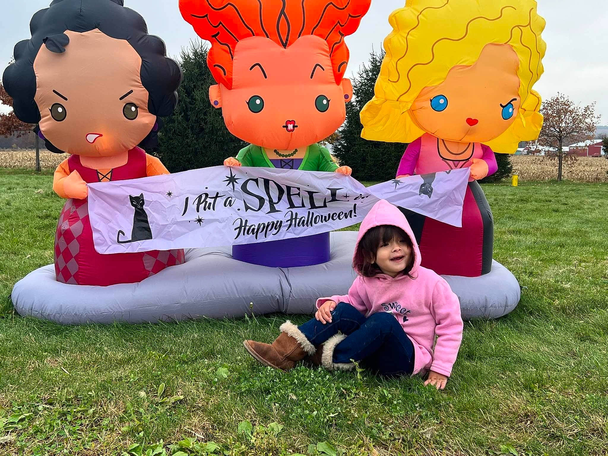 Lana is registered to the contest to win money with this photo: art, facial_expression, fun, grass, green, happy, joy, leisure, mammal, organ, people, people_in_nature, person, pink, plant, recreation, sharing, shoe, sky, smile