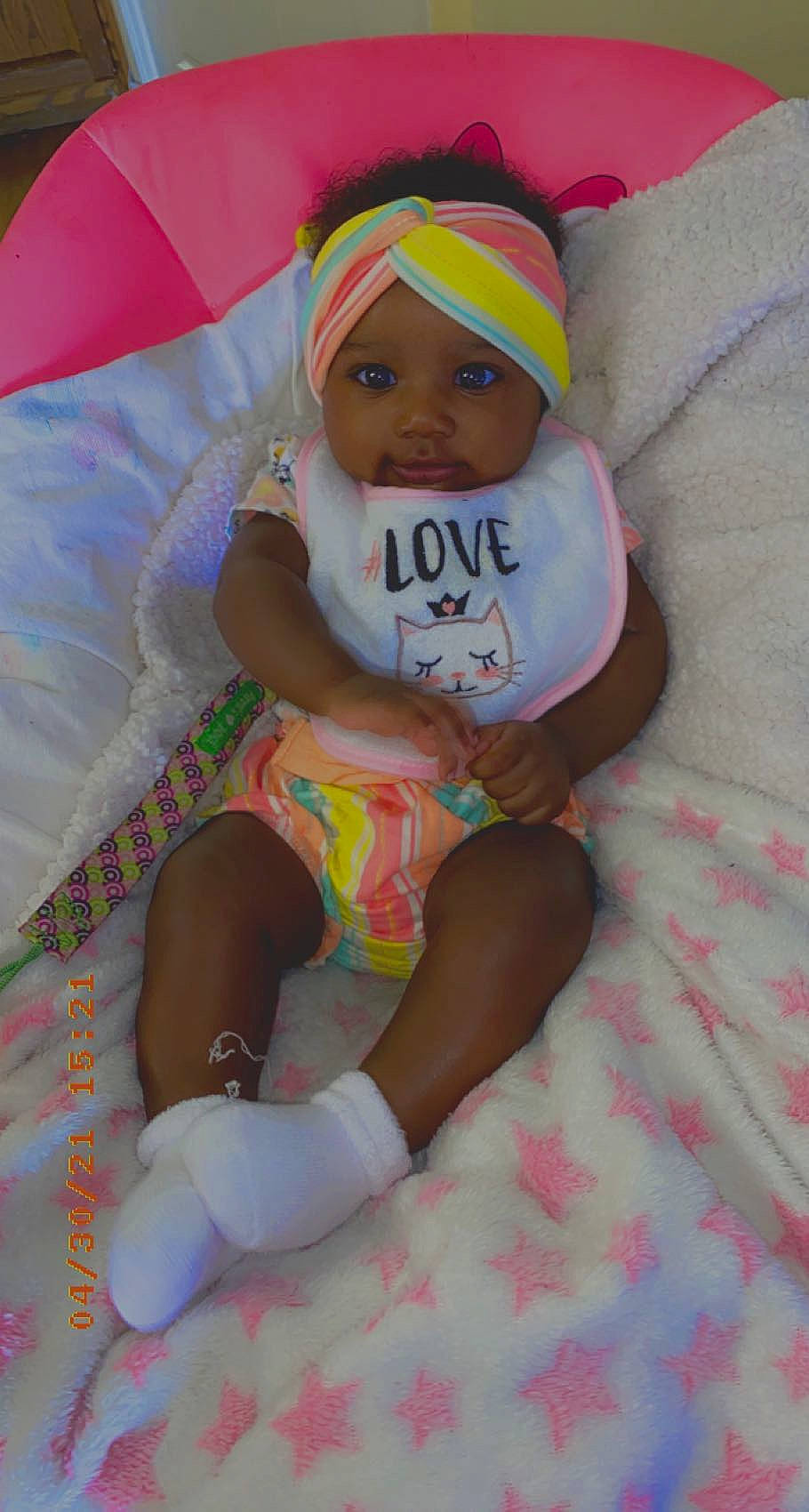 Karmen is registered to the contest to win money with this photo: baby, baby_products, baby_toddler_clothing, cap, child, comfort, face, fun, hand, happy, hat, head, headwear, lap, linens, person, pink, skin, smile, textile