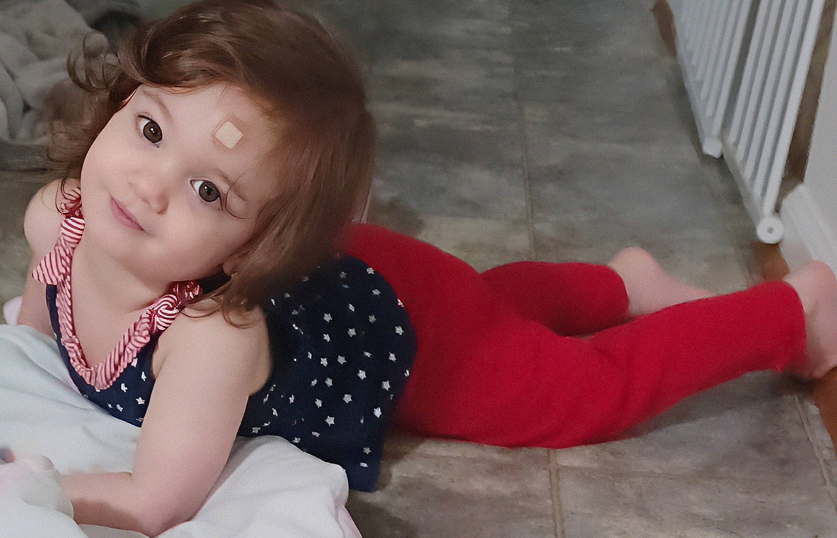 Dakota is registered to the contest to win money with this photo: baby_toddler_clothing, comfort, dress, eye, finger, floor, flooring, happy, human_body, joint, knee, leg, mouth, person, skin, sleeve, smile, standing, textile, thigh